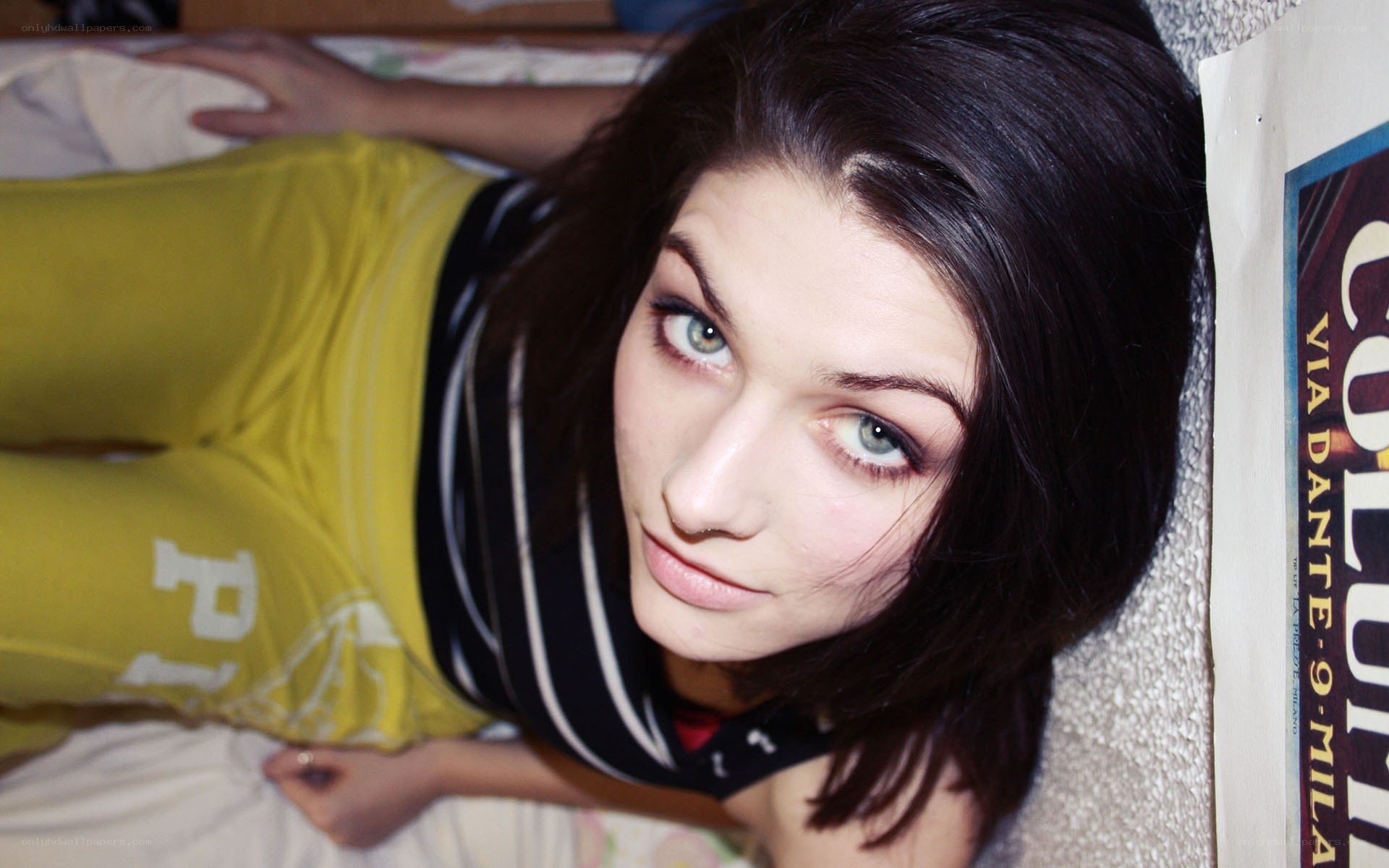 woman lying on bed looking up