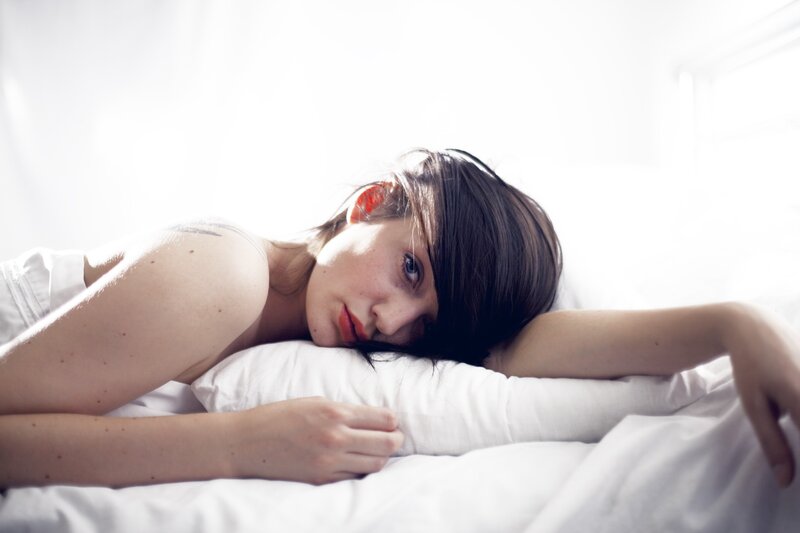Woman Lying on Bed — Morning, Brown