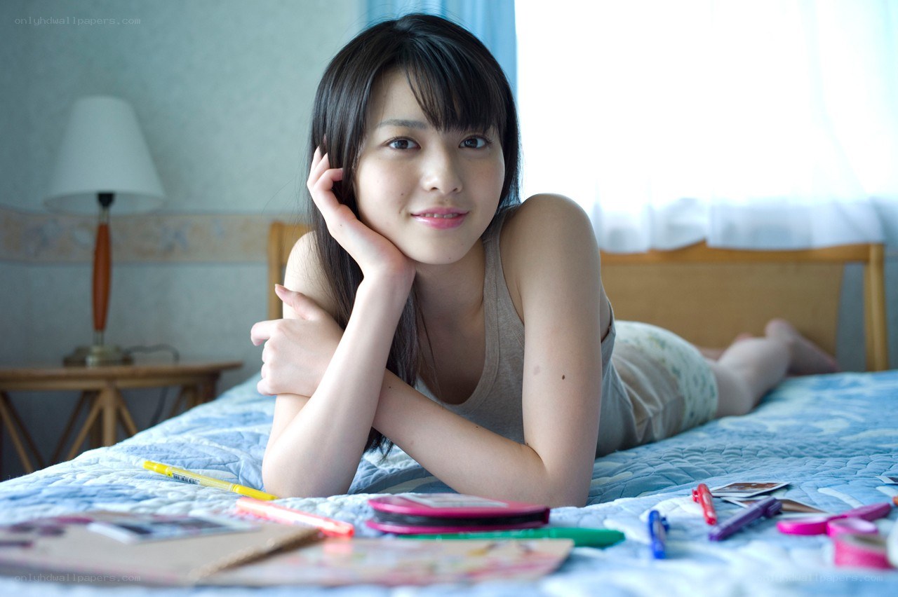 woman lying on bed smiling