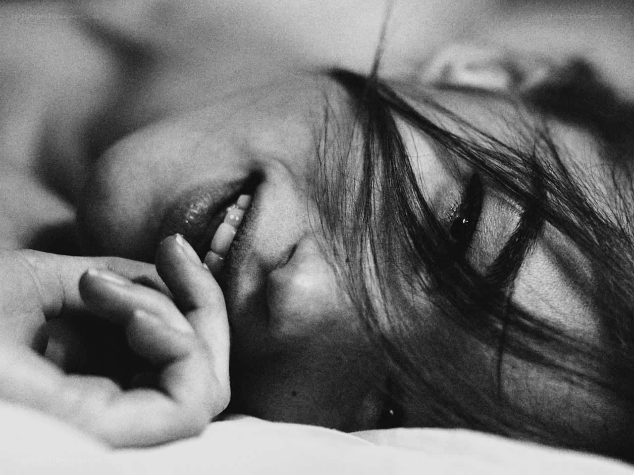 woman lying on bed smiling