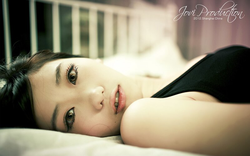 Woman Lying on Bed — White, Calm, Photograph, Black Top, Pillow, Black
