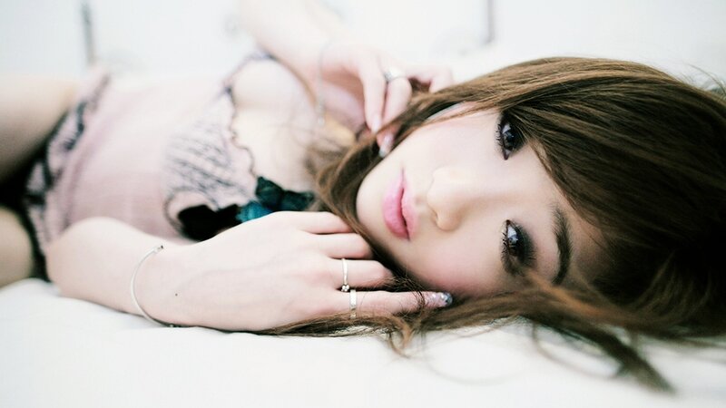 Woman Lying on Bed — White, Calm, Photograph, Lacy Top