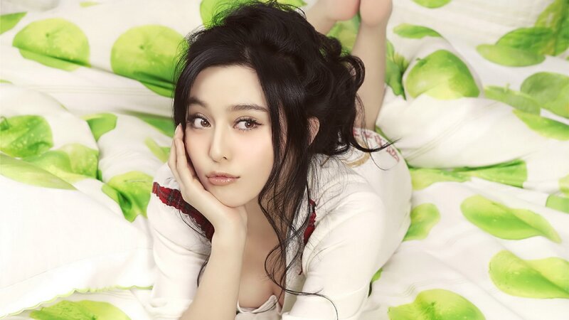 Woman Lying on Bed — White, Relaxed, Photograph, Pillow, Hand, Green, Black
