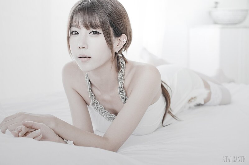 Woman Lying on Bed — White, Serene, Photograph, Necklace