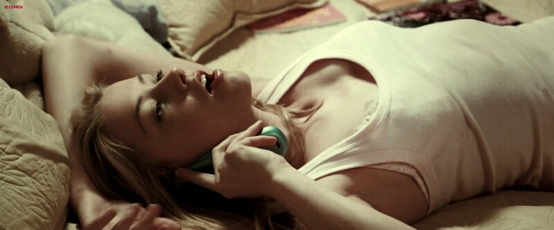 woman lying on bed with phone