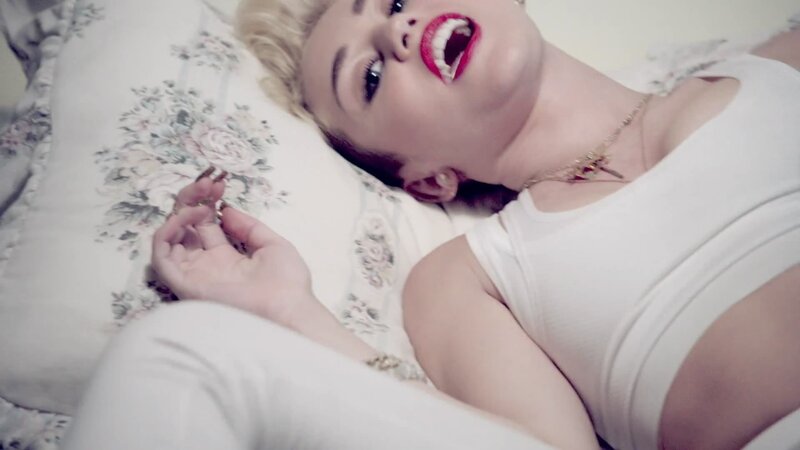 woman lying on bed with red lipstick