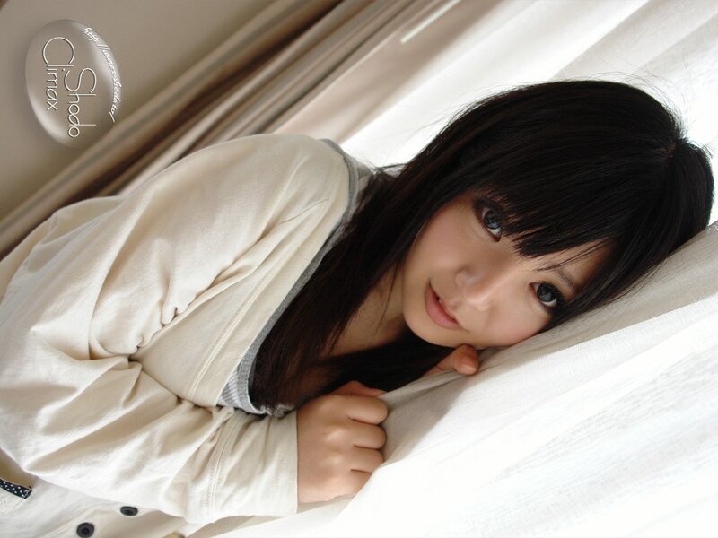 woman lying on bed with white sheets