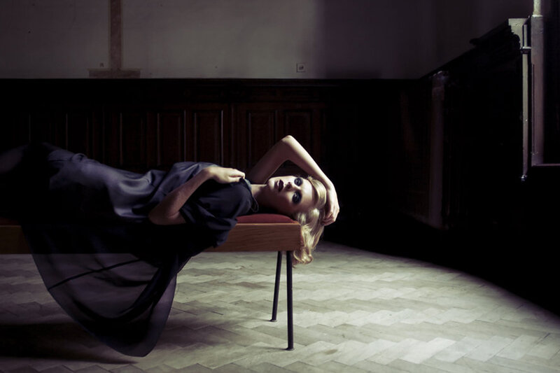 Woman Lying on Bench — Black, Dramatic, Photograph, Floor