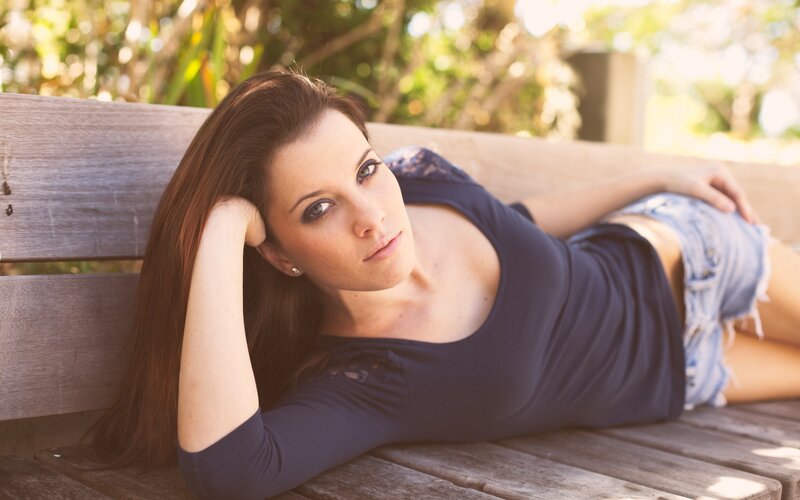 Woman Lying on Bench — Blue, Relaxed, Afternoon, Photograph, Trees