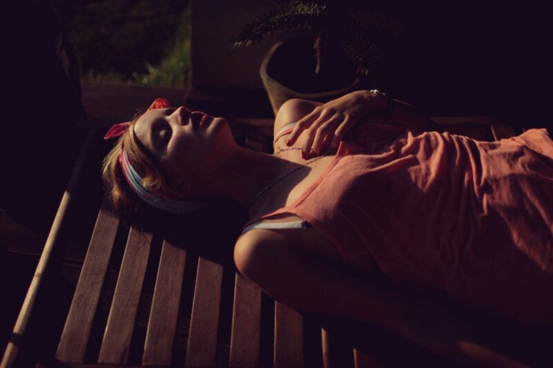 Woman Lying on Bench — Brown, Dramatic