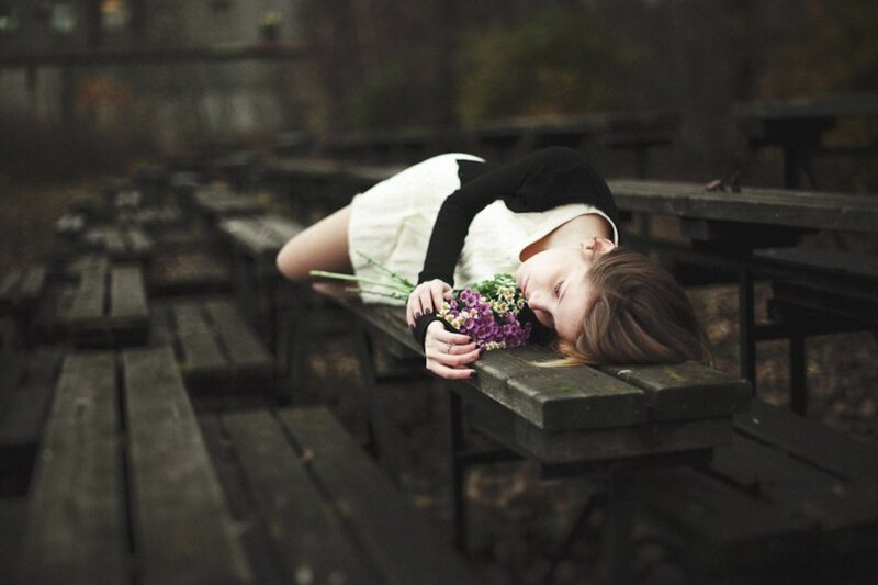Woman Lying on Bench — Brown, Somber
