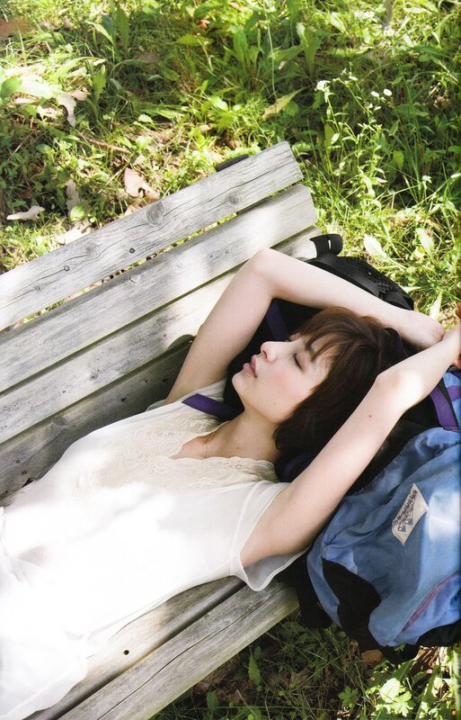Woman Lying on Bench — White, Serene, Afternoon