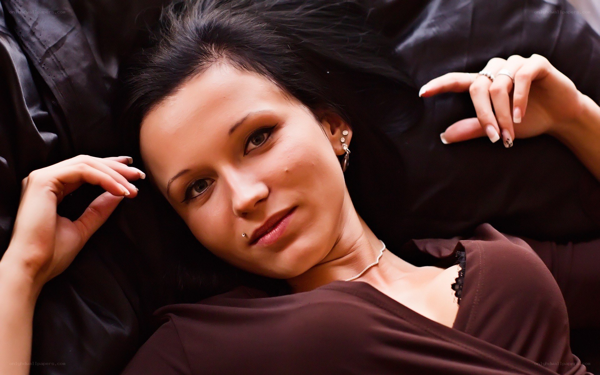 woman lying on black surface
