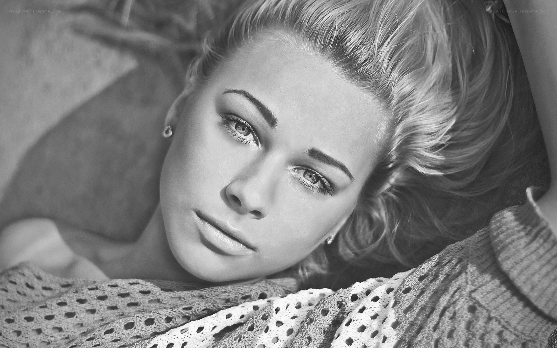 woman lying on blanket