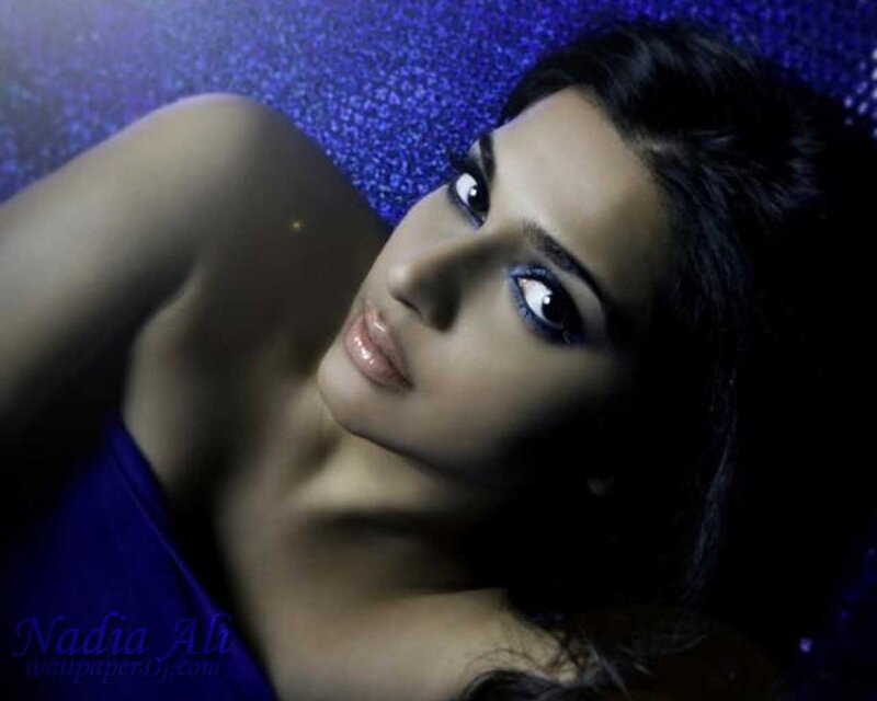 Woman Lying on Blue Surface — Dramatic