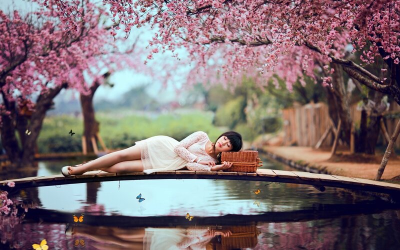 Woman Lying on Bridge