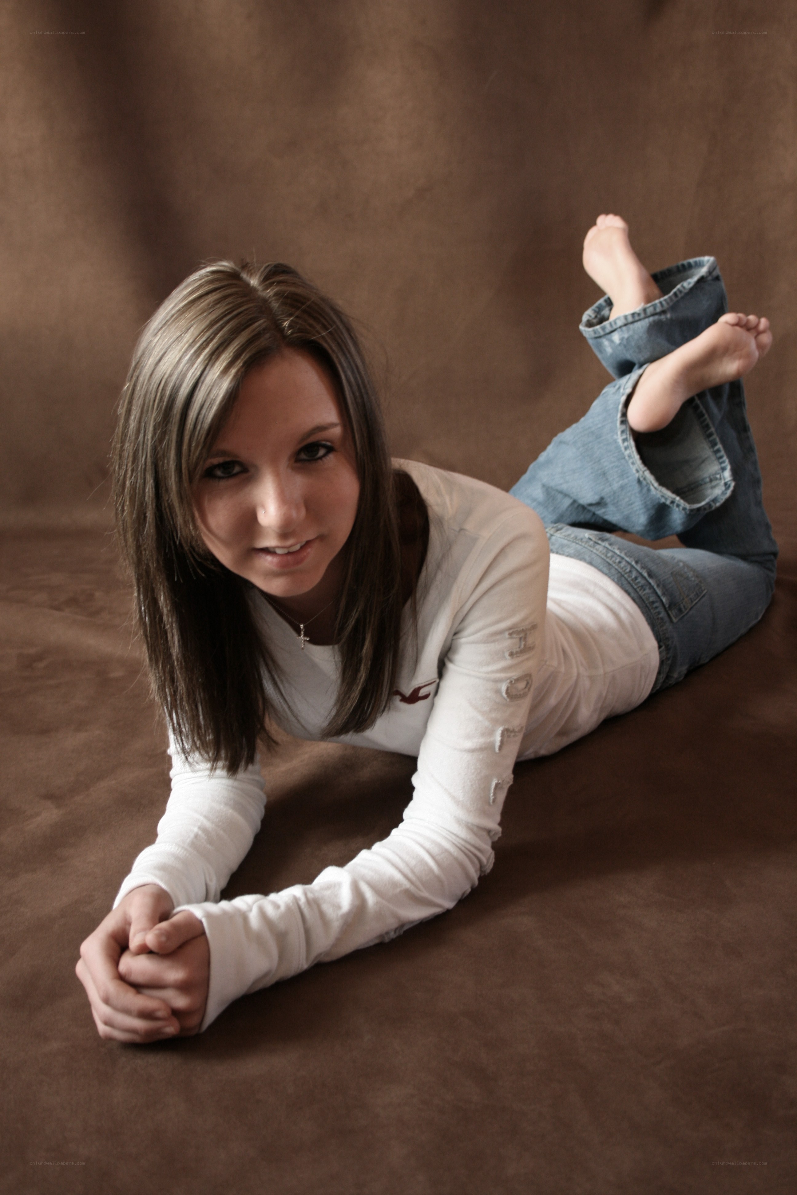 woman lying on brown surface