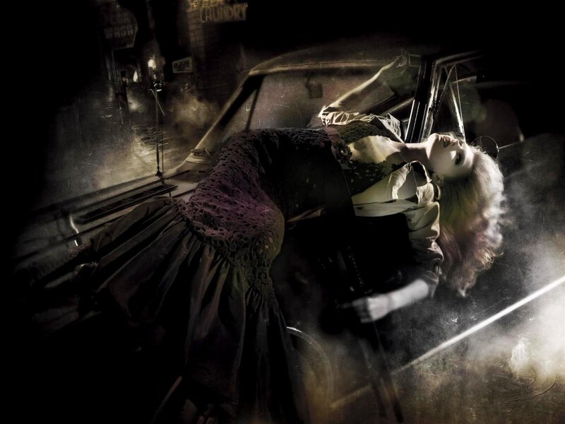 woman lying on car hood