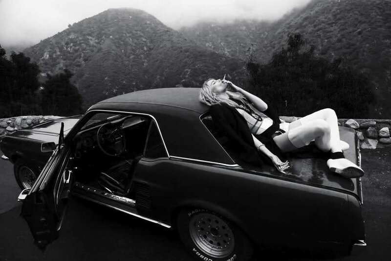 Woman Lying on Car