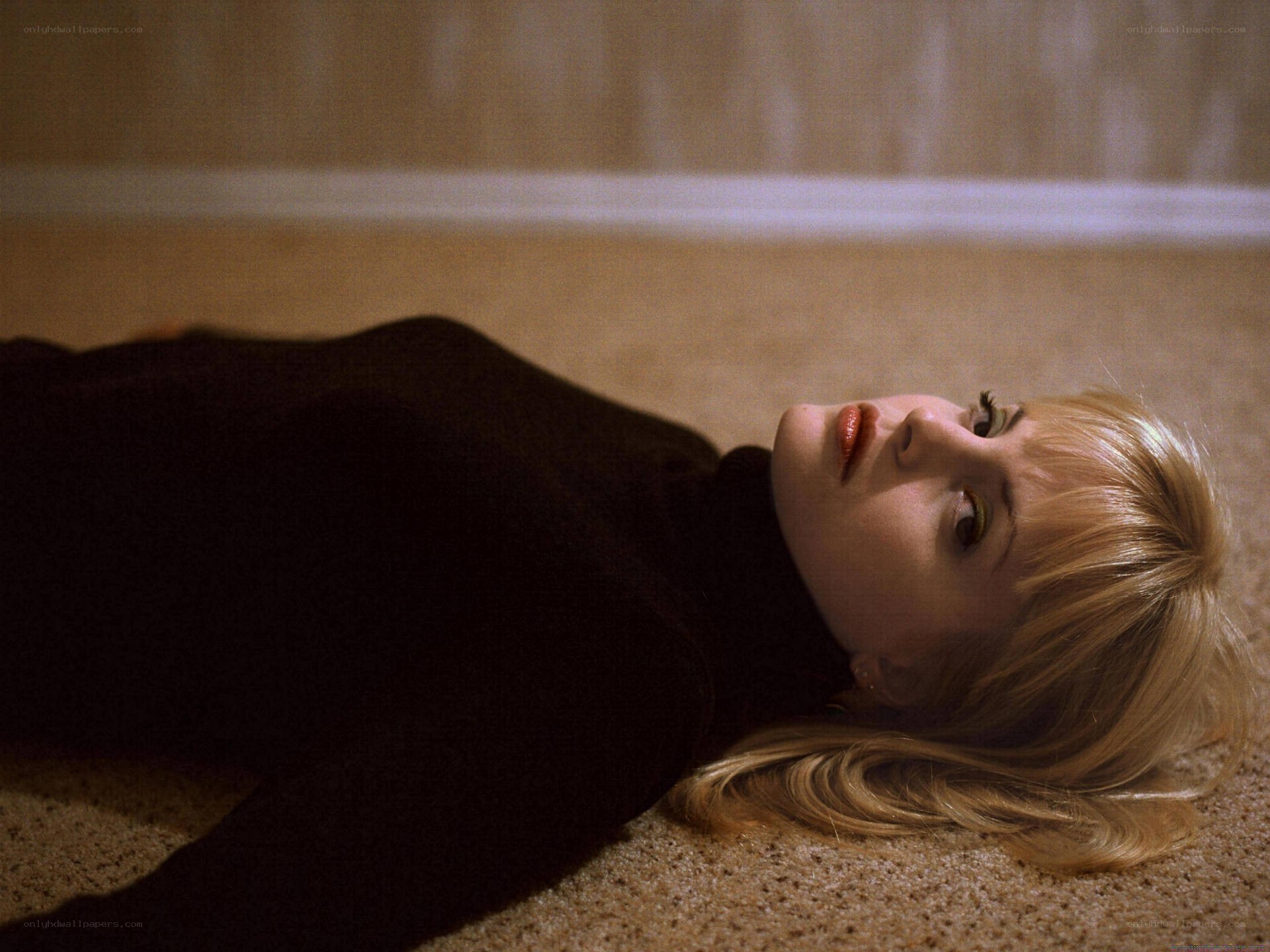 woman lying on carpet