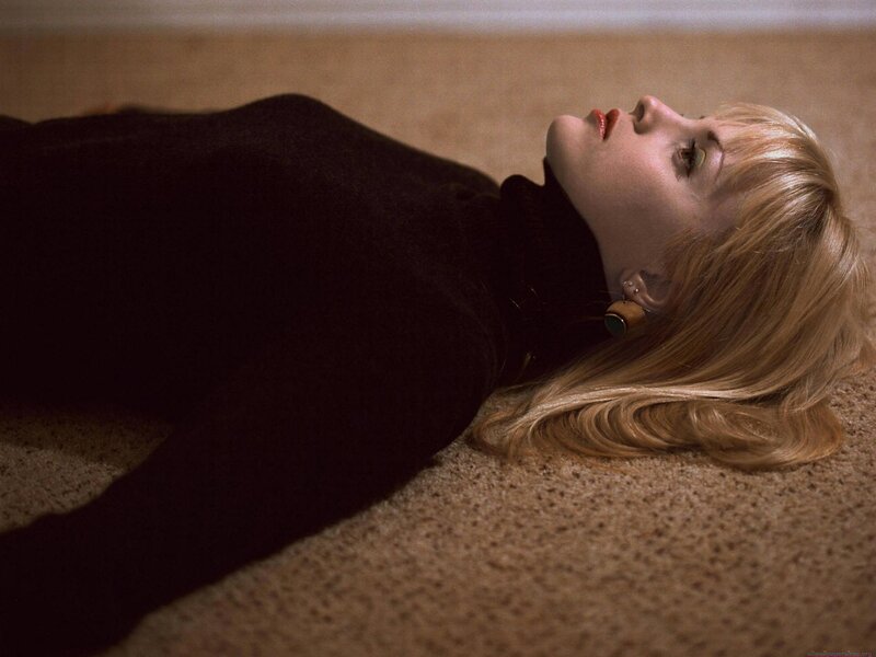 Woman Lying on Carpet — Brown, Dramatic, Photograph, Earring