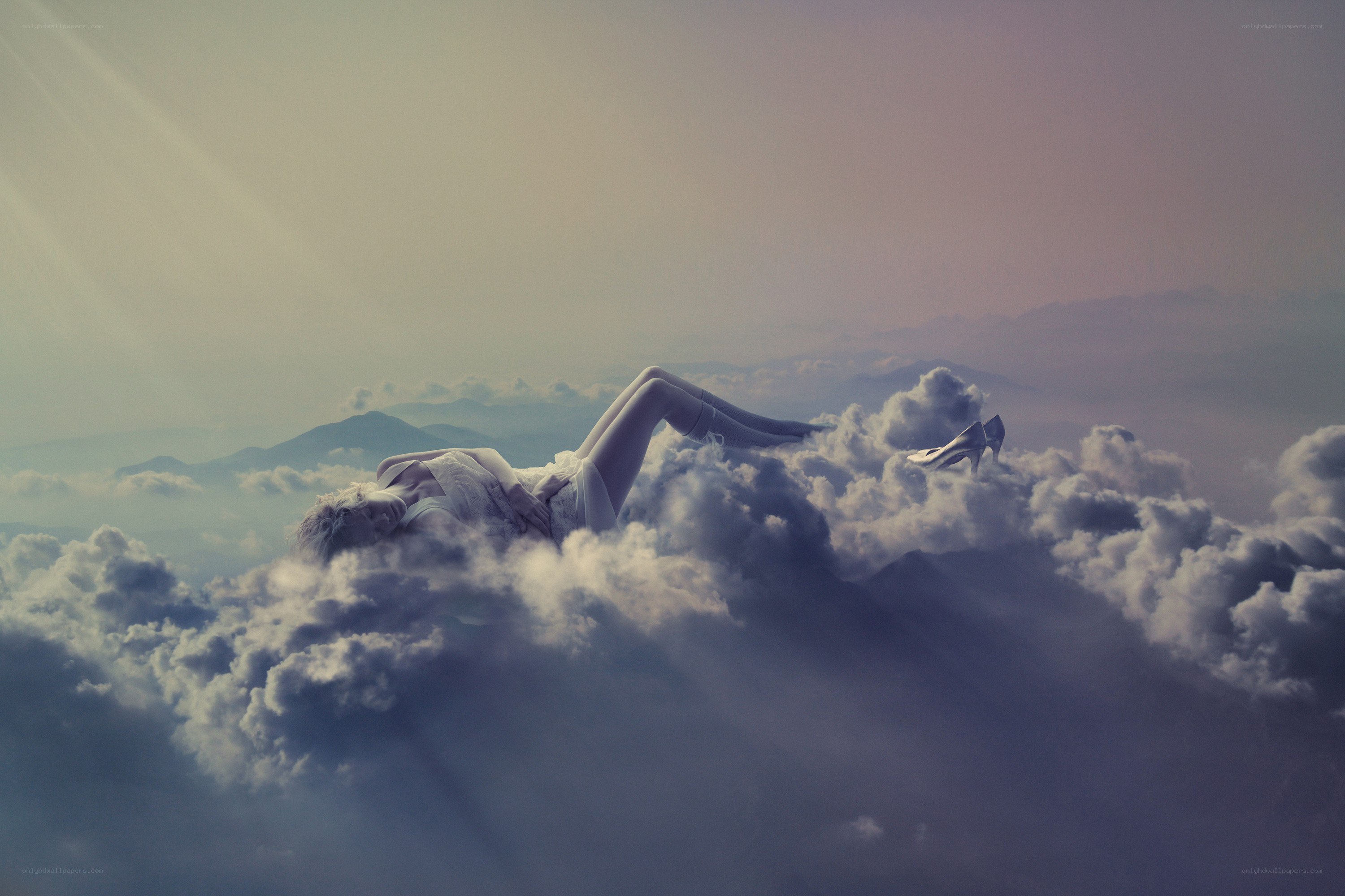 woman lying on clouds
