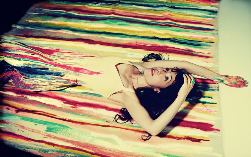 woman lying on colorful art