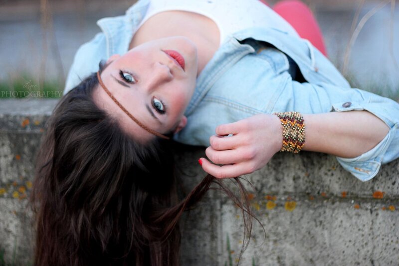 woman lying on concrete