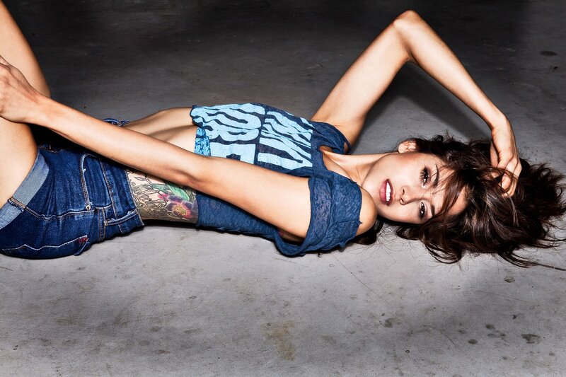 woman lying on concrete floor