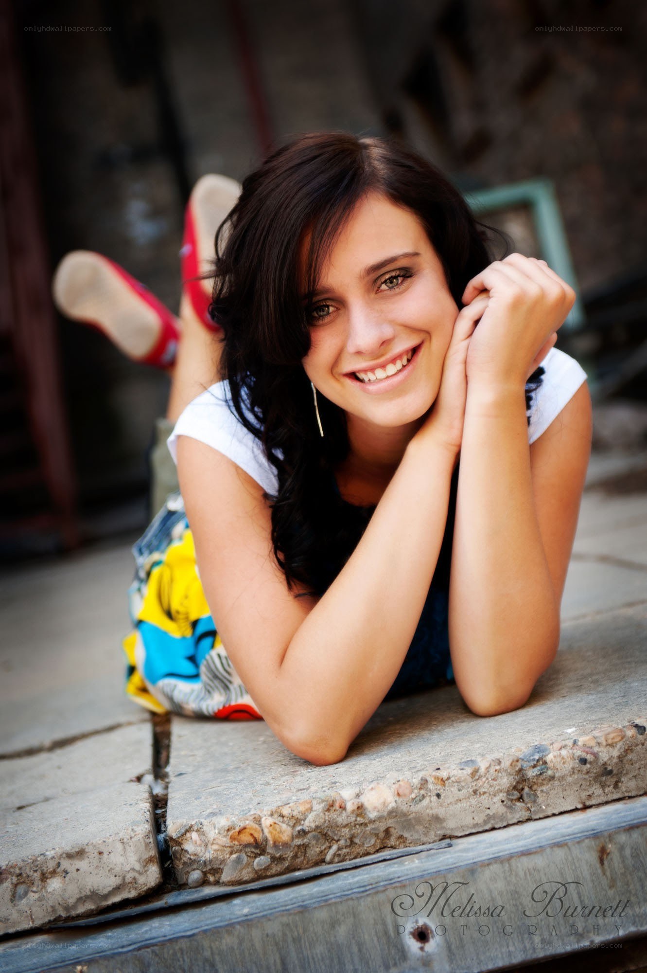 woman lying on concrete steps