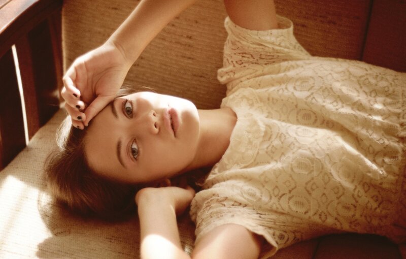 Woman Lying on Couch — Beige, Calm