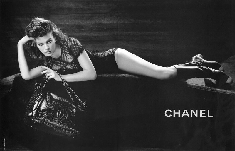Woman Lying on Couch — Black, Dramatic, Photograph, Handbag