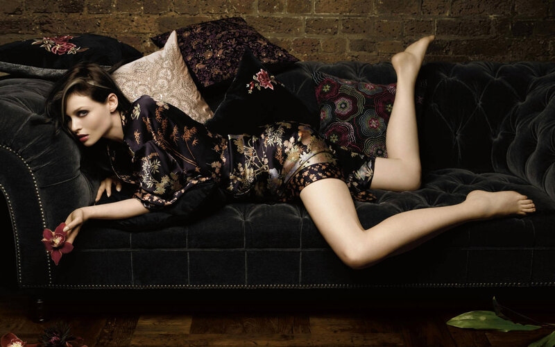 Woman Lying on Couch — Black, Dramatic, Photograph, Pillows