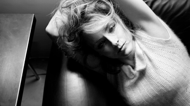 Woman Lying on Couch — Black, Dramatic, Photograph, Table