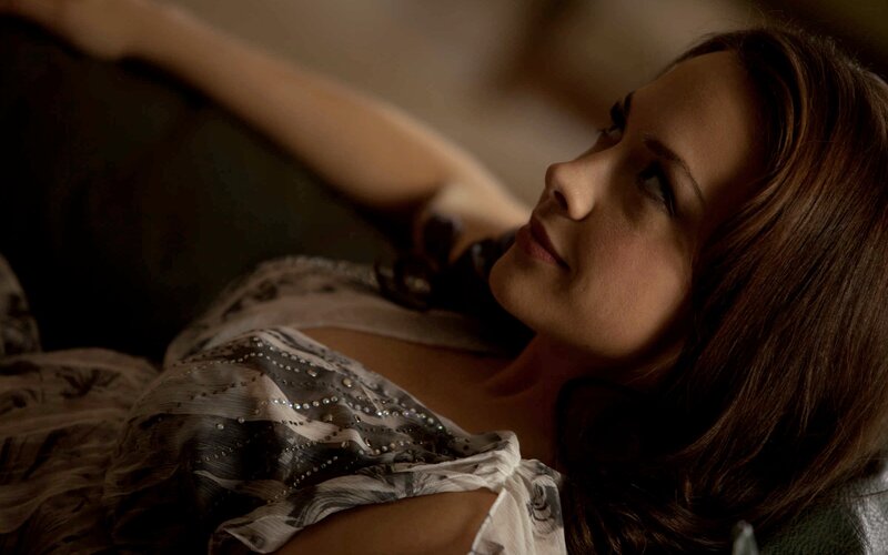 Woman Lying on Couch — Brown, Contemplative