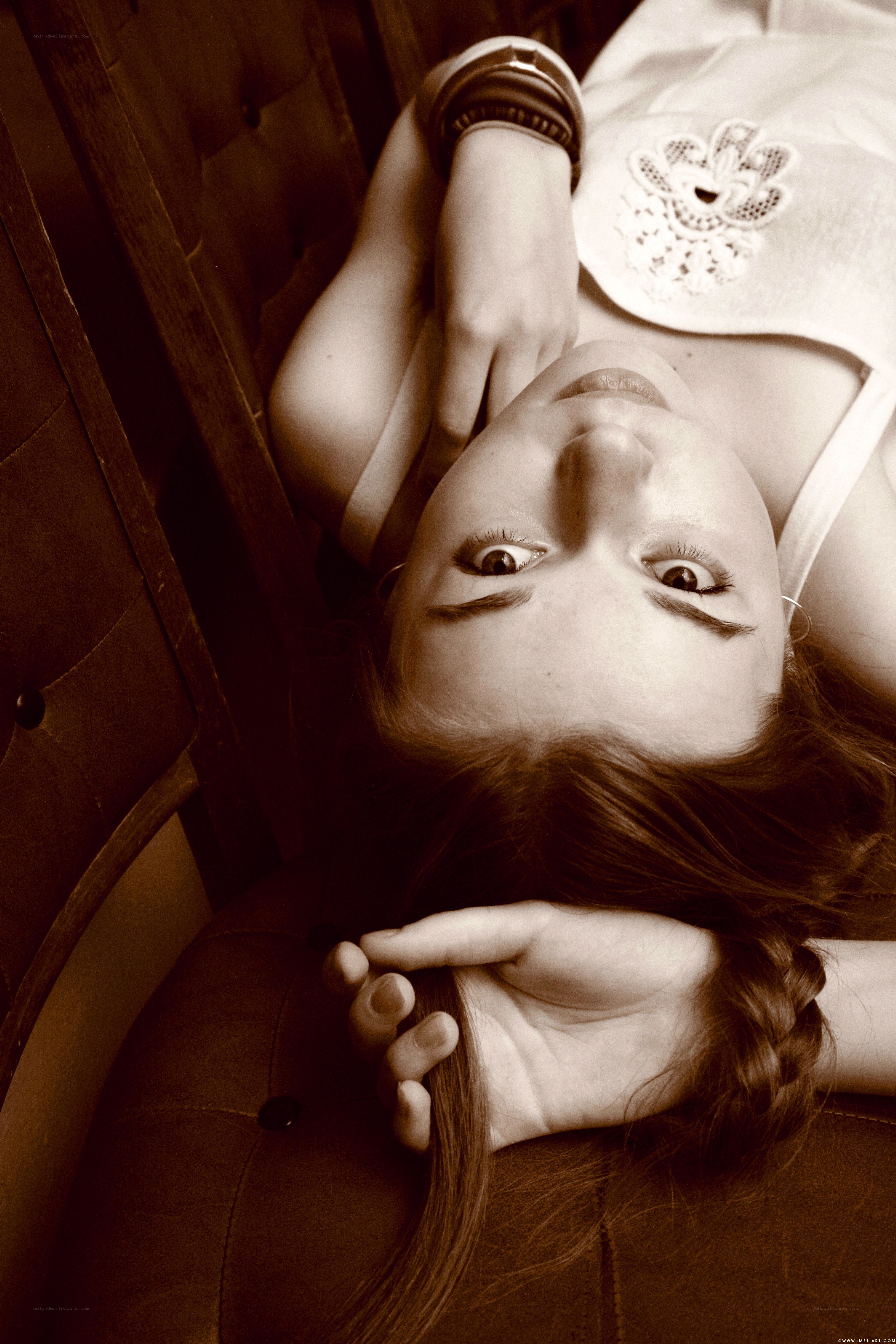 woman lying on couch looking up