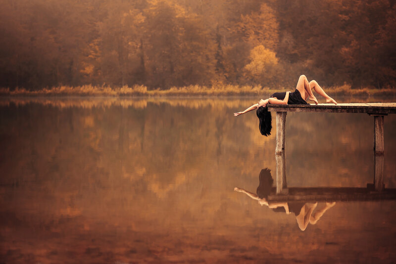 Woman Lying on Dock — Brown, Serene