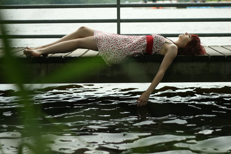 Woman Lying on Dock — Green