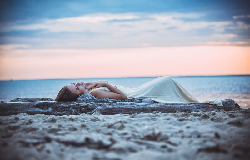 Woman Lying on Driftwood — Blue