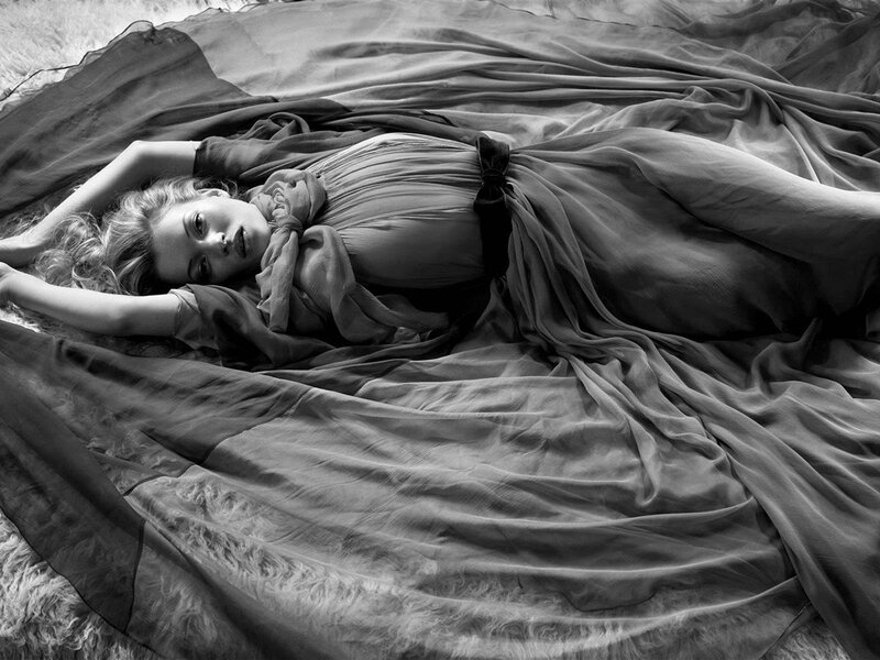 woman lying on fabric