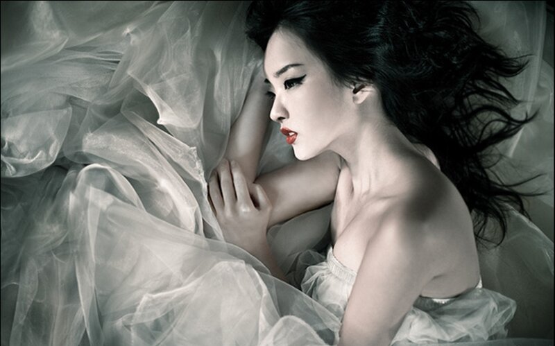 Woman Lying on Fabric — White