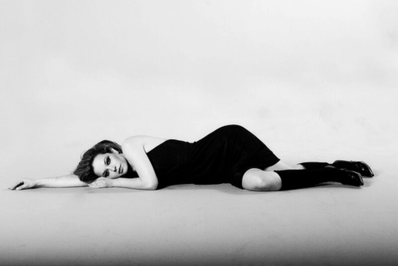 Woman Lying on Floor — Black, Dramatic, Photograph, Dress, Boots