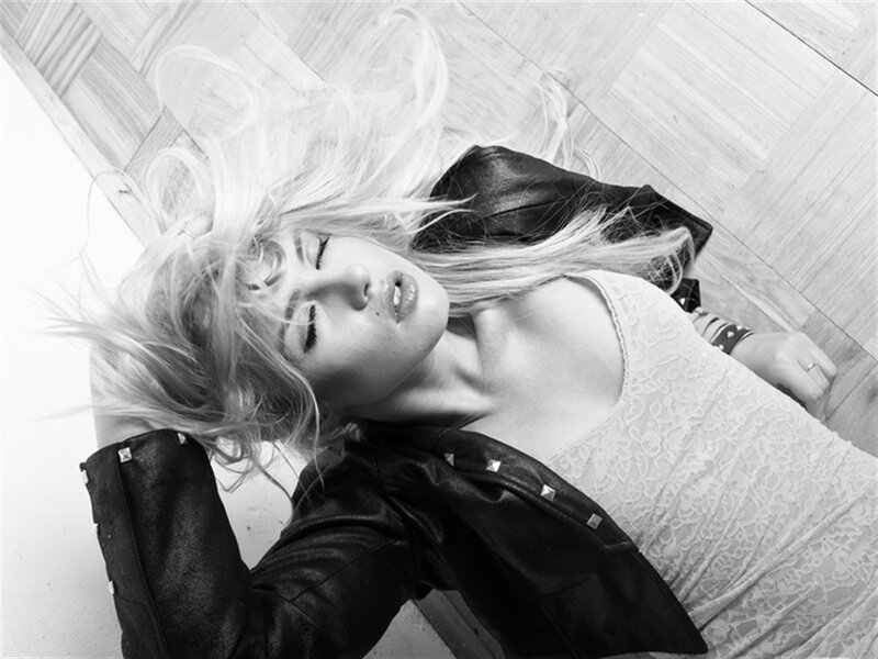 Woman Lying on Floor — Black, Dramatic, Photograph, Leather Jacket