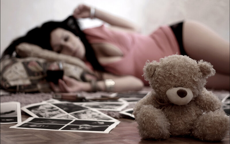 Woman Lying on Floor — Brown, Melancholic