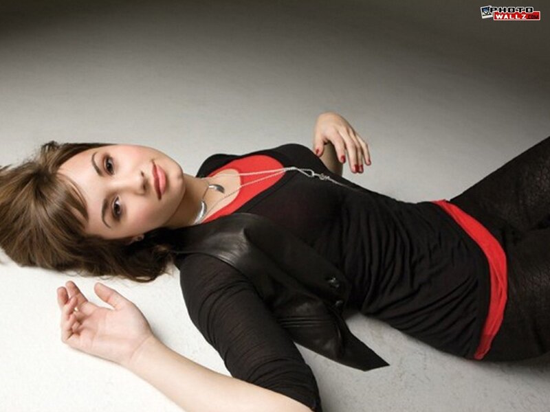 woman lying on floor in black and red