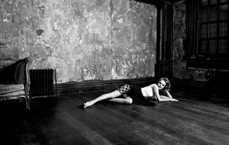 woman lying on floor in old room