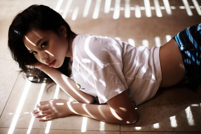 woman lying on floor in sunlight