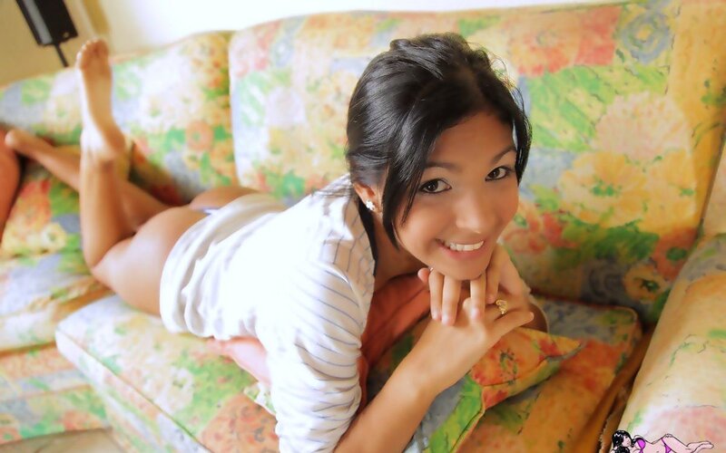 woman lying on floral couch