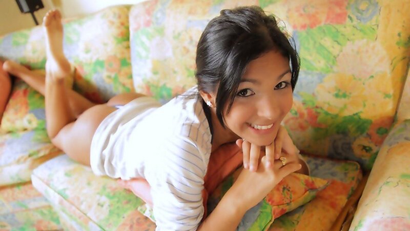 woman lying on floral couch