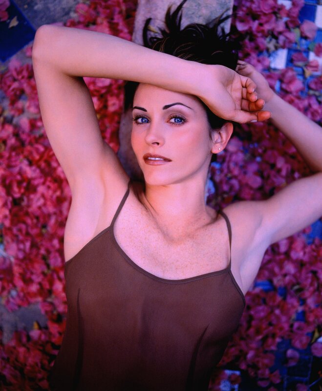 woman lying on flowers